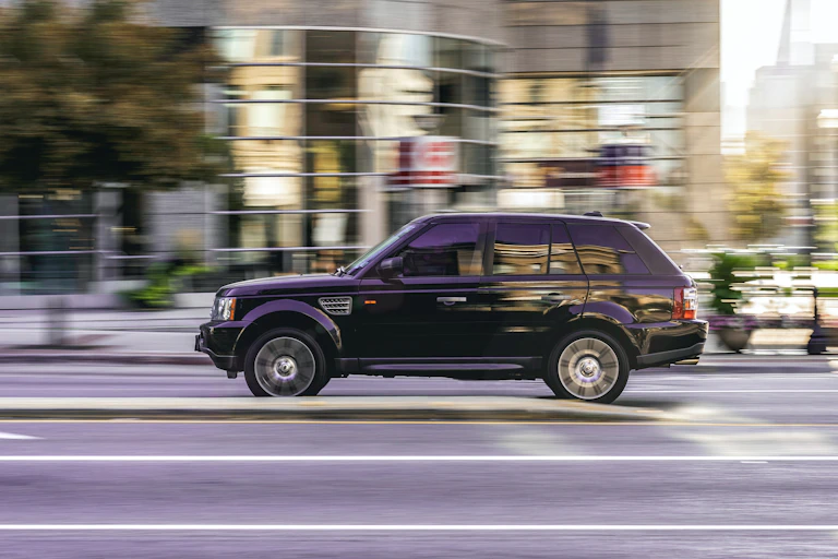 An SUV driving along a street