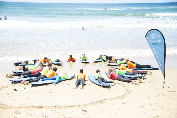 Learning to surf on land, in a group