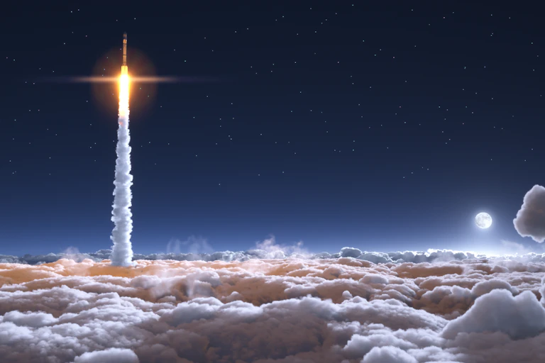 A rocket emerging through clouds at night producing a large plume of smoke.