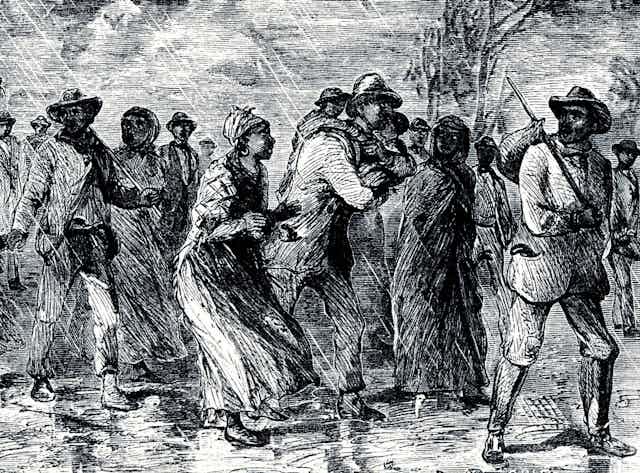 This illustration shows a group of black men and women walking through woods in the rain.