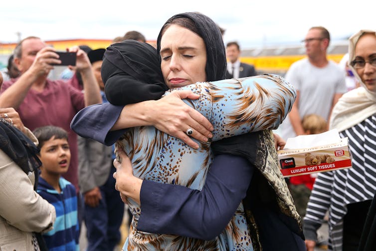 Jacinda Ardern hugging a mosque-goer at the Kilbirnie Mosque