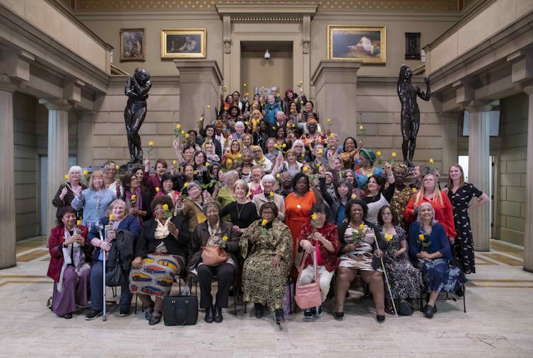 Women gathered together in an art gallery