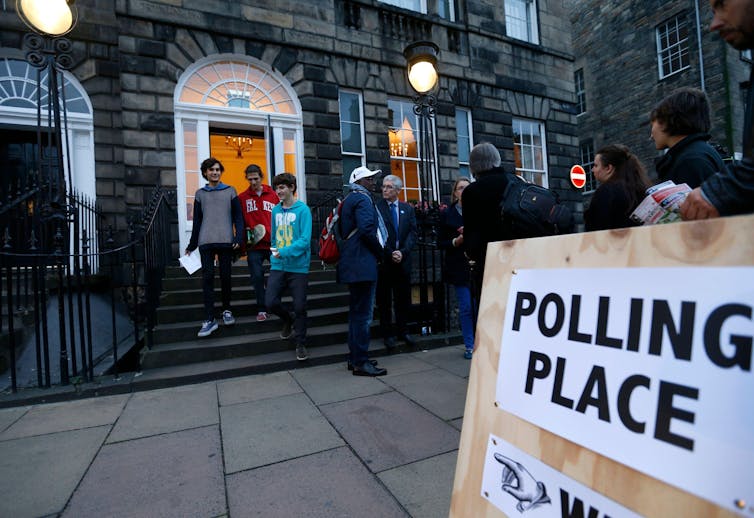 Young voters leaving a polling place in Edinburgh