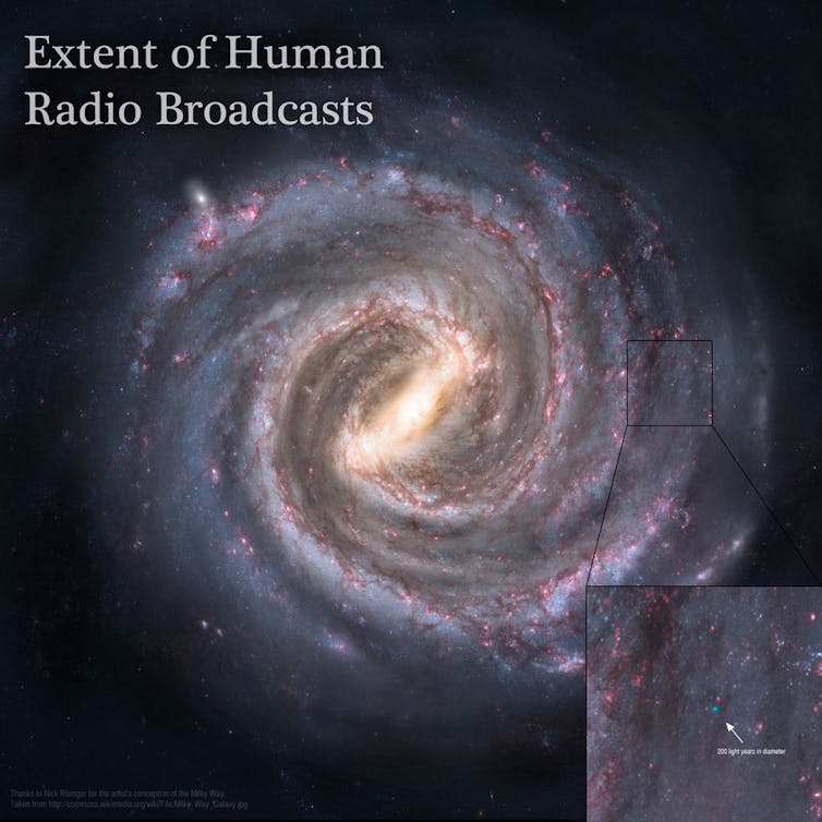 An image of a spiral galaxy with a box on the lower right corner centred on a tiny blue dot