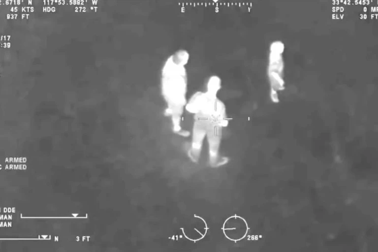 A nightvision image of a group of people seen from above.