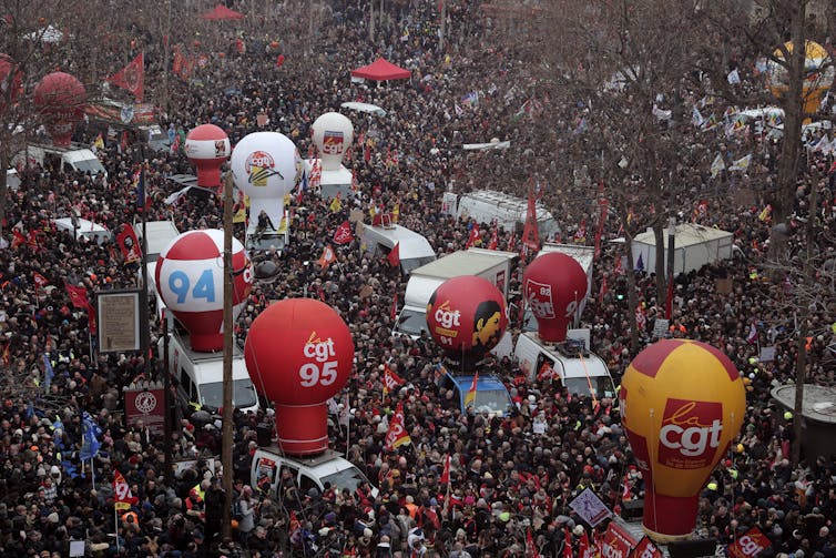 Workers gather on Place de la Republique, Paris, to demonstrate against proposed pension changes, Thursday, January 19, 2023.