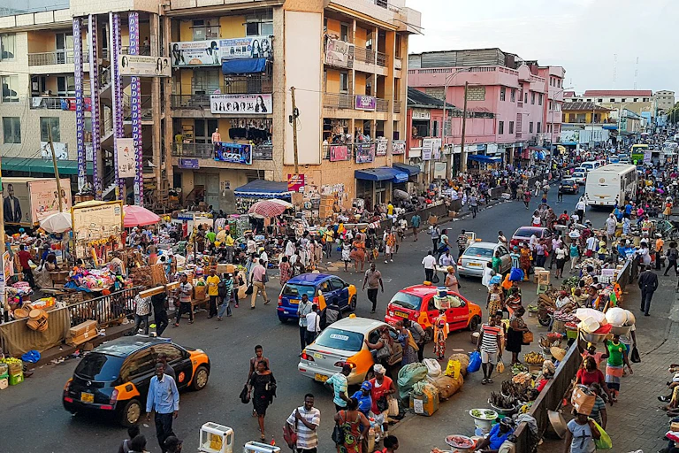 A street with several buildings and many people