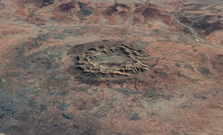 A large rocky circle on a red landscape seen from above