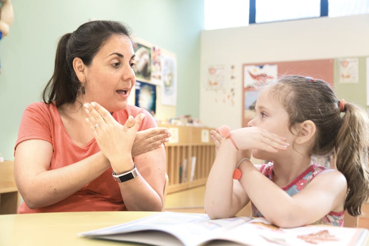 woman and girl doing one-on-one learning in classroom