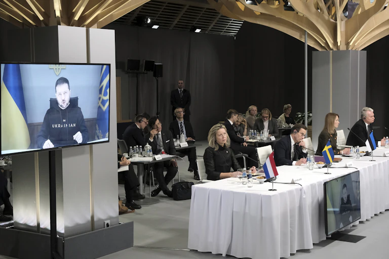 Ukrainian president Volodymyr Zelensky delivers an address via video link to a meeting of defence ministers at Rammstein base in Germany.