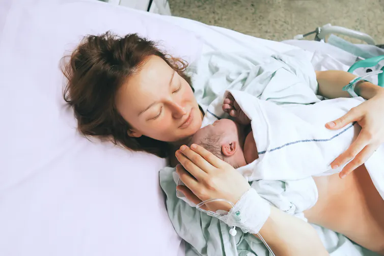 Mother holding her baby