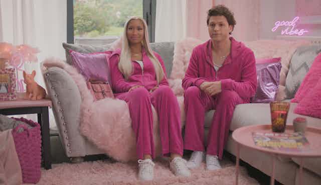 Deepfakes of Nicki Minaj and Tom Holland wear matching hot pink tracksuits.