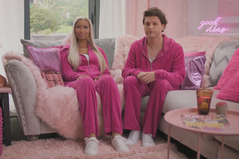 Deepfakes of Nicki Minaj and Tom Holland wear matching hot pink tracksuits.