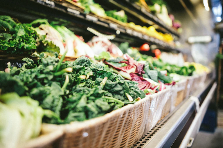 Veggies lined in a grocery store.