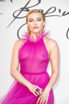 Florence Pugh poses before Valentino fashion show in a pink, sheer dress