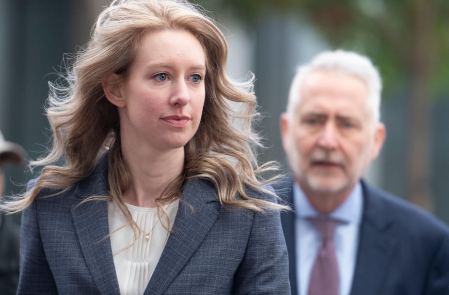 Close up of Elizabeth Holmes in a blazer walking to court