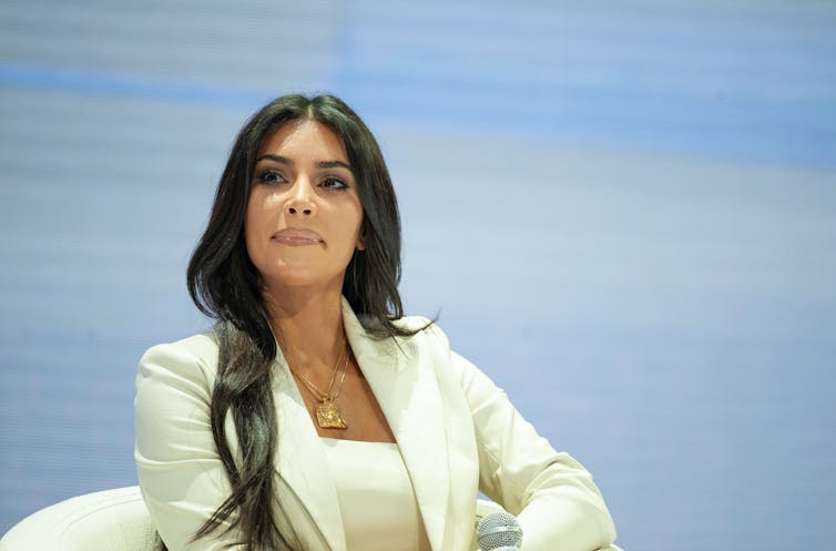 Kim Kardashian in a white suit