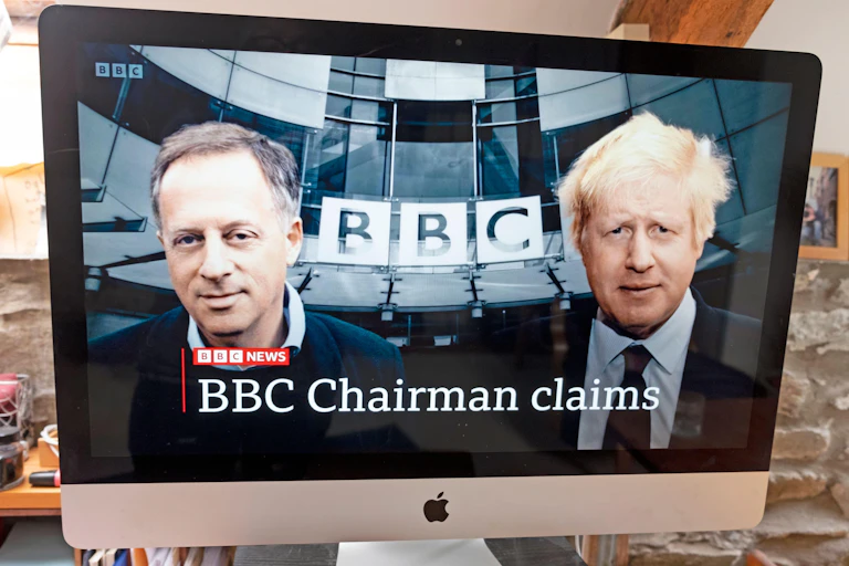 A screenshot from BBC news whosing BBC chairman Richard Sharp and former prime minister Boris Johnson outside Broadcasting House