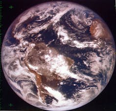 A colour photo of the whole Earth centred around South America.