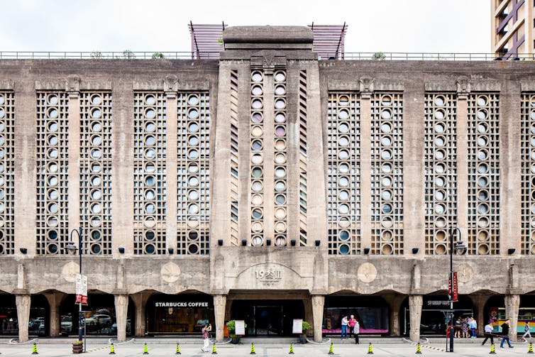 A frontal view of a decorative concrete façade.