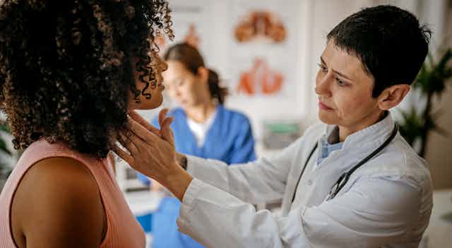 Female doctor doing a medical examination.