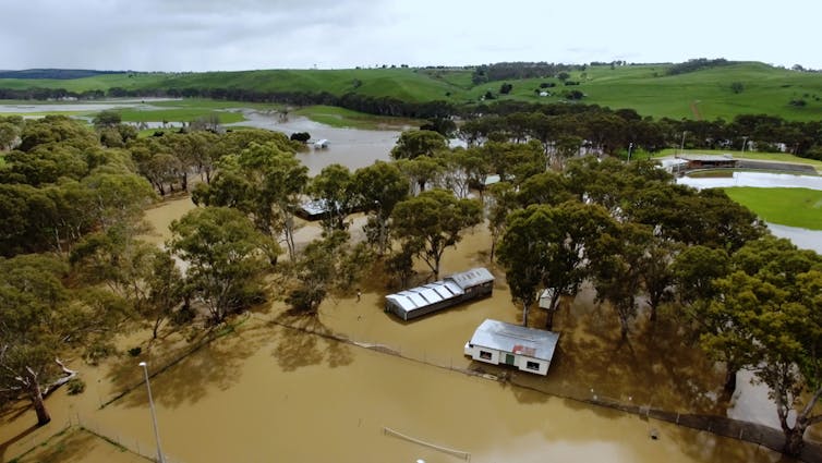 A flooded town is seen form the sky via an aerial shot taken by a drone.