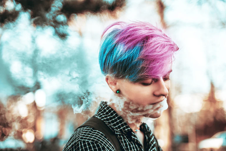 A young woman vaping