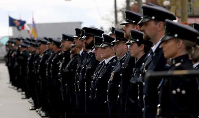 A line of police officers in full uniform.