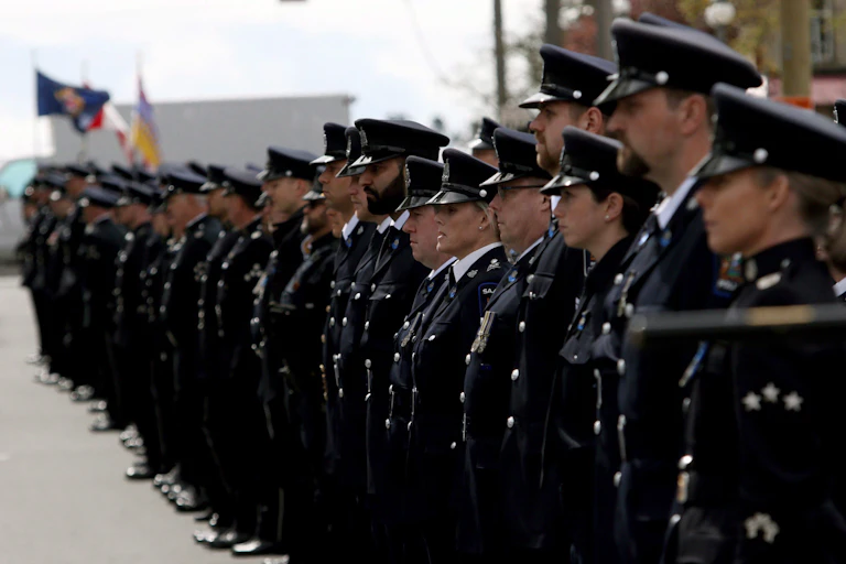 A line of police officers in full uniform.
