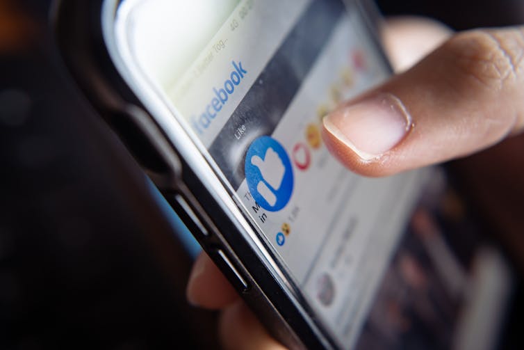 A smartphone with the Facebook app open.