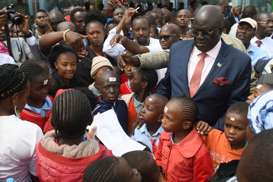 Prof George Magoha with school pupils and parents