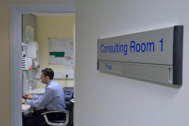 A GP in his consulting room