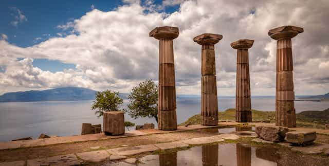 Columns seen against a blue sky.