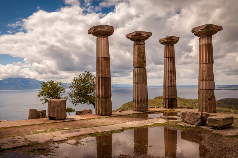 Columns seen against a blue sky.