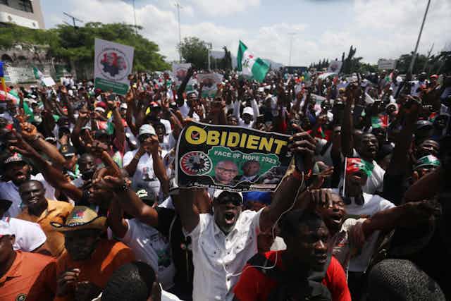 Supporters of Labour Party (LP) walk on a highway during a one million march for the presidential candidate of Nigeria's LP, Peter Obi