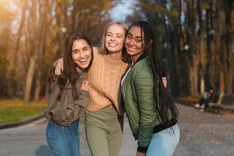 Three girls outside in warm clothes