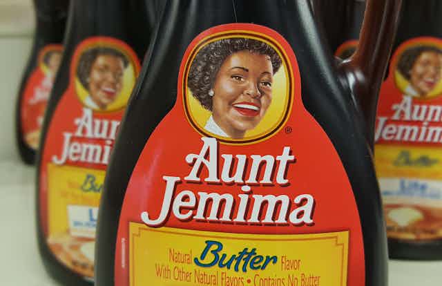 A plastic syrup bottle with 'Aunt Jemima' written across the front