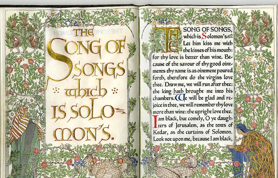 An open book shows a richly illustrated version of the 'Song of Songs,' covered with pictures of vines and flowers.
