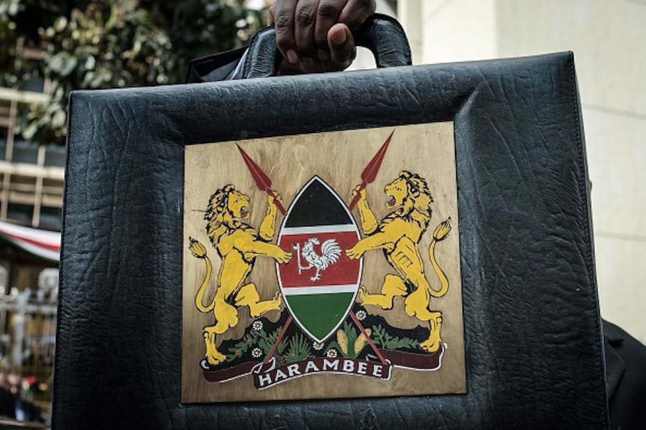 An image of the Kenyan budget briefcase being held up.