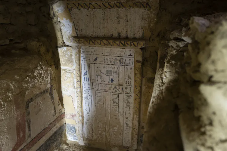 The door to a tomb covered in hieroglyphics.