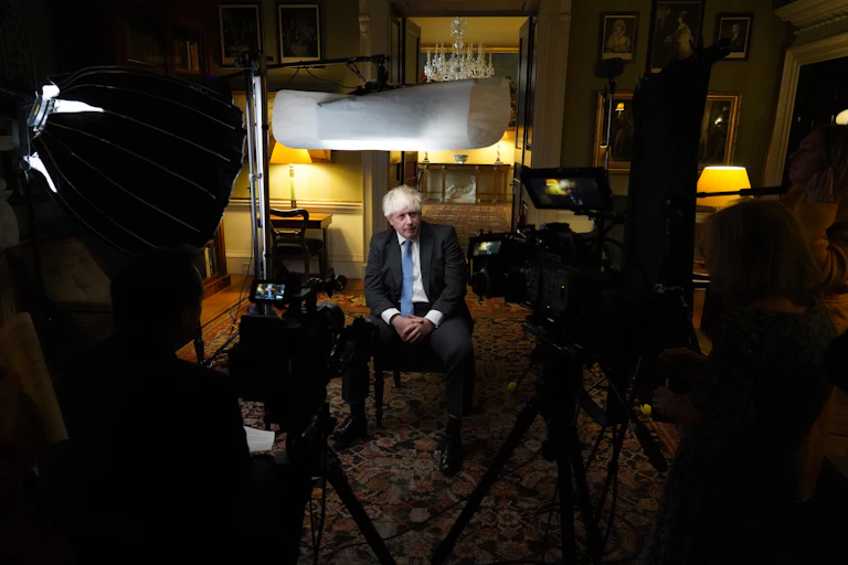 Politician on set giving an interview.