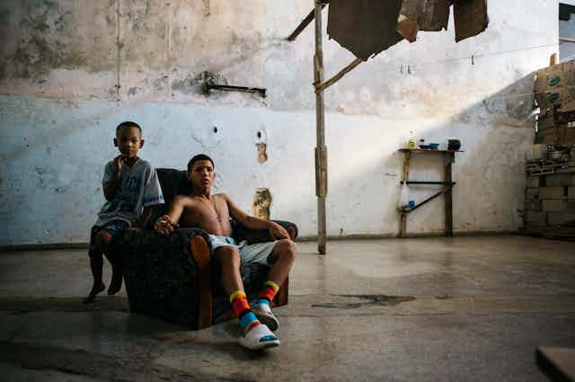 Boys in an abandoned building in Centro Habana, Havana. Cuba – December 2022