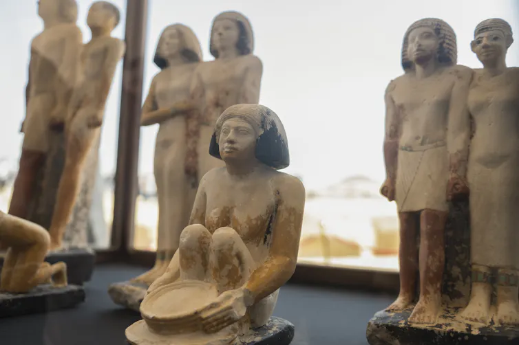 Ancient Egyptian statues show men and women holding hands.