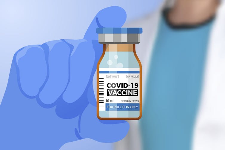 An illustration of a hand holding a vial of COVID vaccine.