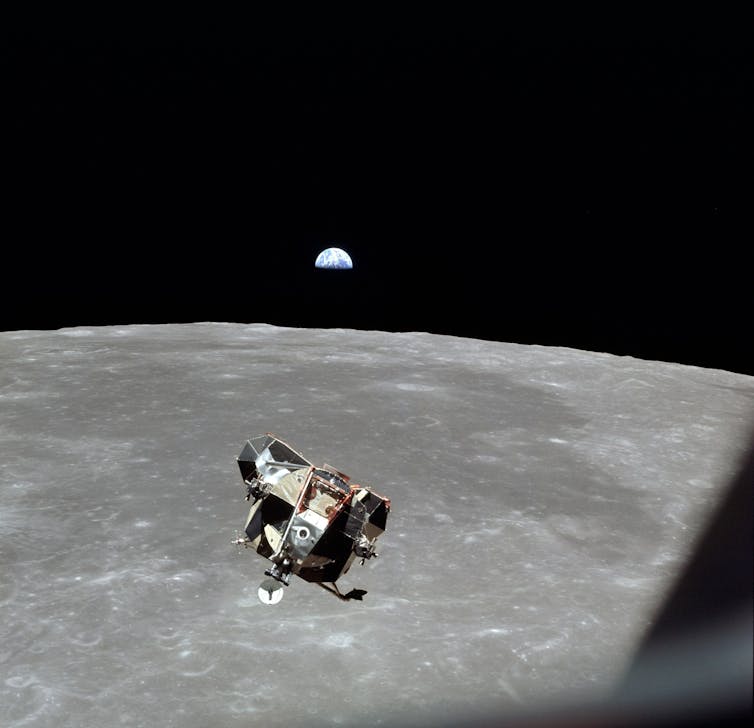 A lunar lander from Apollo 11 lifting off from the surface of the Moon.