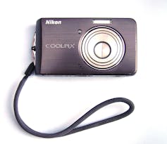 A sleek and minimalist point-and-shoot digital camera from 2008.