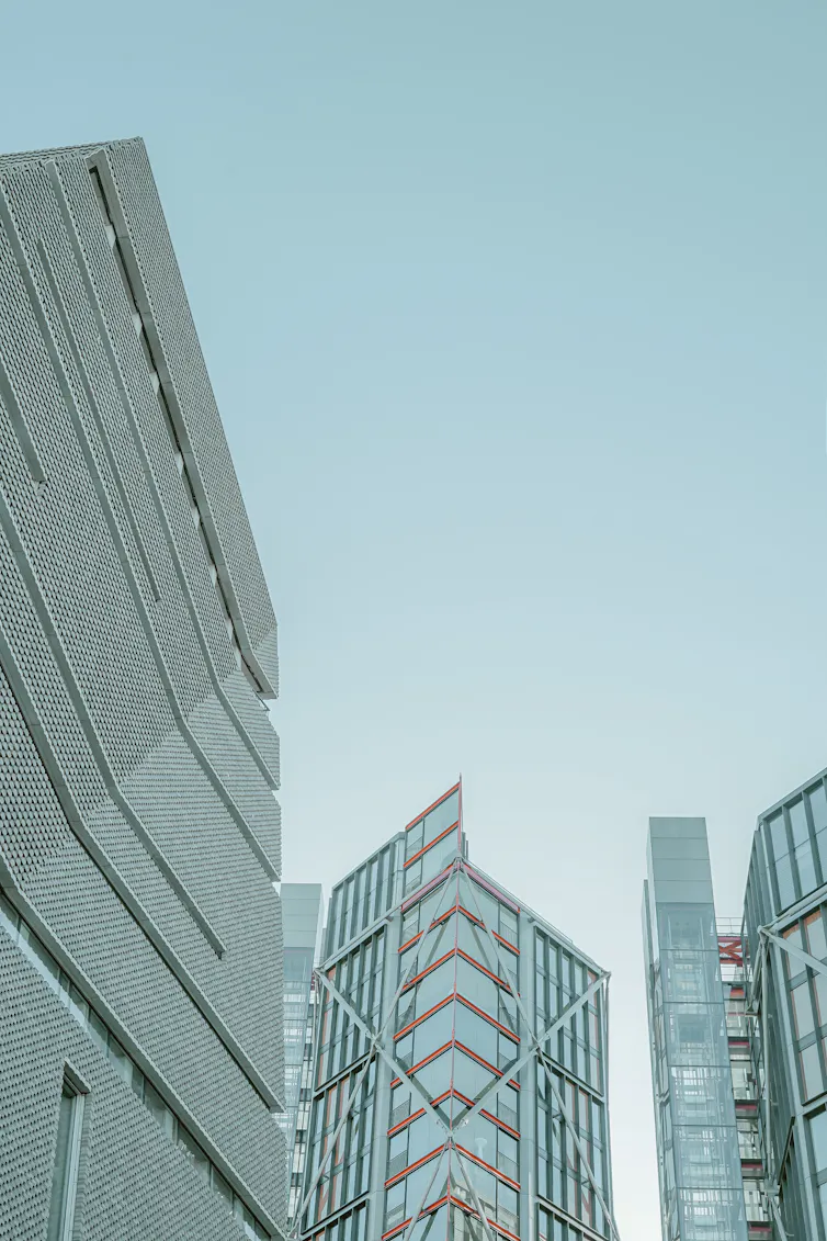 HIgh-rise buildings against a pale blue sky.