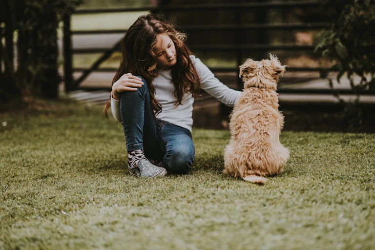 Girl pats dog