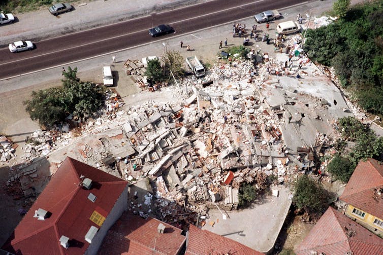 An aerial photo of a collapsed building.