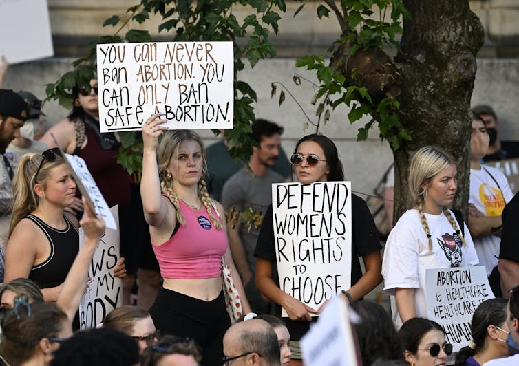 Young women protest restrictions on access to abortion.